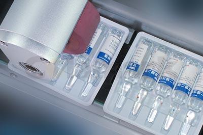 高速臥式智能貼標入托機